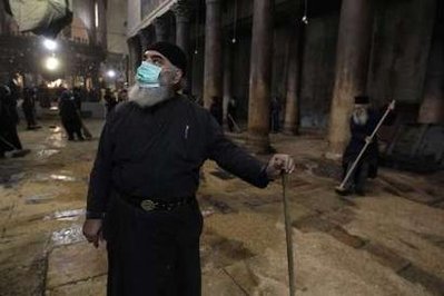 Palestinian Muslims helping to clean the Church