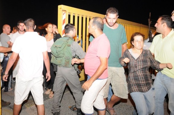 Palestinians and activists scuffle with with settlers of Almon