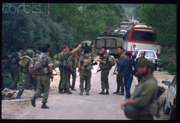 06 Apr 1988, West Bank --- Fighting between Jewish Settlers and Palestinians. Soldiers at the village's entrance. | Location: Beta, West Bank.  --- Image by  Bernard Bisson/Sygma/Corbis