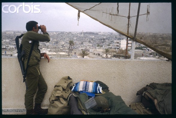 April 1988, Israel --- 6 months of disturbances in the occupied territories. Gaza: the Great Beach. Palestinian camp with the Israeli army. --- Image by Bernard Bisson/Sygma/Corbis