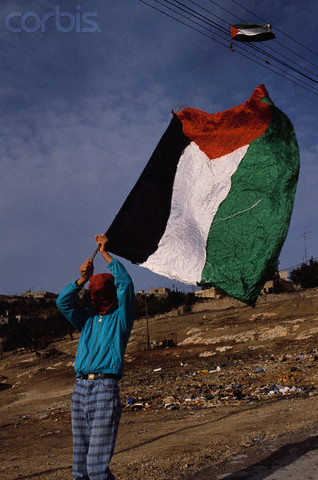 09 Dec 1989, Jerusalem, Israel --- A masked Palestinian demonstrates in the Jewish settlement of Jebel Mukaber on the second anniversary of the Intifada, a violent Palestinian uprising against the Israeli occupation. | Location: Jebel Mukaber, Jerusalem, Israel.  --- Image by Ricki Rosen/CORBIS SABA