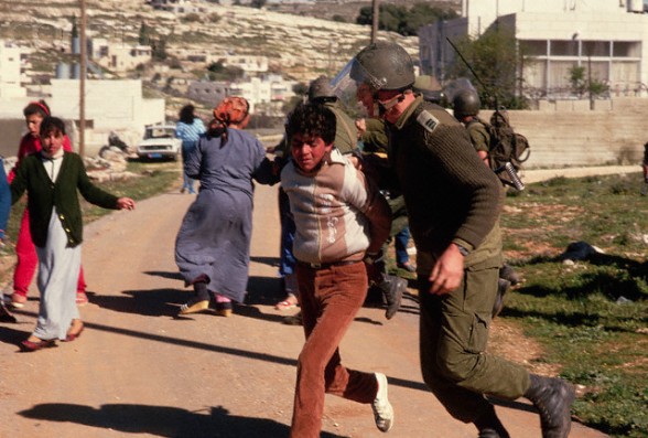 16 Mar 1988, West Bank --- Israeli Soldier Arresting Palestinian Boy --- Image by  Peter Turnley/CORBIS