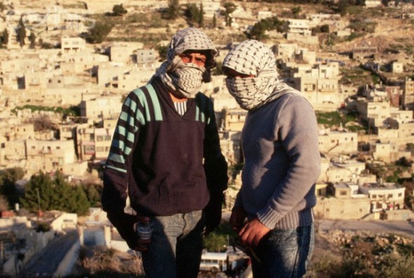 1988, West Bank --- Masked Palestinian Guerrillas --- Image by  Peter Turnley/CORBIS