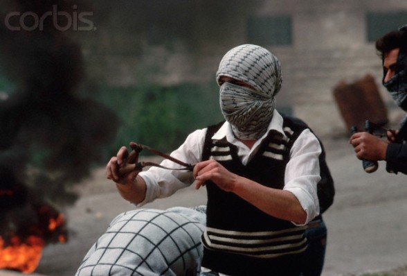 March 18-19, 1988, West Bank --- Masked Palestinians fight against the occupying Israeli forces in the West Bank. --- Image by  Peter Turnley/CORBIS