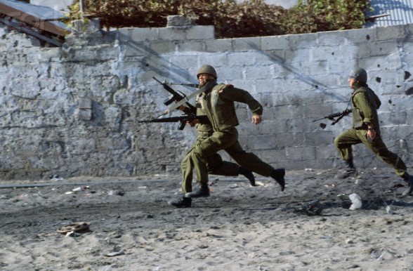 1993, Gaza, Gaza Strip --- Israeli soldiers respond to Palestinian protesters during a 1993 uprising in Gaza. --- Image by Peter Turnley/CORBIS