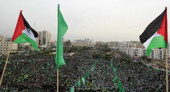 Palestinian and Hamas flags flutter as t