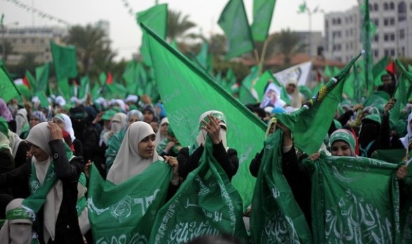 Palestinian supporters of Hamas wave the