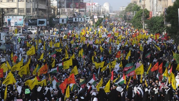 Pakistani Shiite Muslims march during a rally against Israel and the United States to mark the Al-Quds (Jerusalem) day on the last Friday in the month of Ramadan in Karachi on August 17, 2012. Shiite Muslim protesters rallied across the country against the United States and Israel and prayed for the liberation of Palestine. AFP PHOTO / RIZWAN TABASSUM
