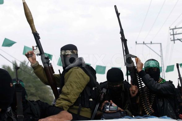 Members of the Ezzedine al-Qassam brigades the armed wing of Hamas, carry their weapons as they celebrate a truce between Gaza and Israel - Nov 21 2012 Photo by Abed Rahim Khatib