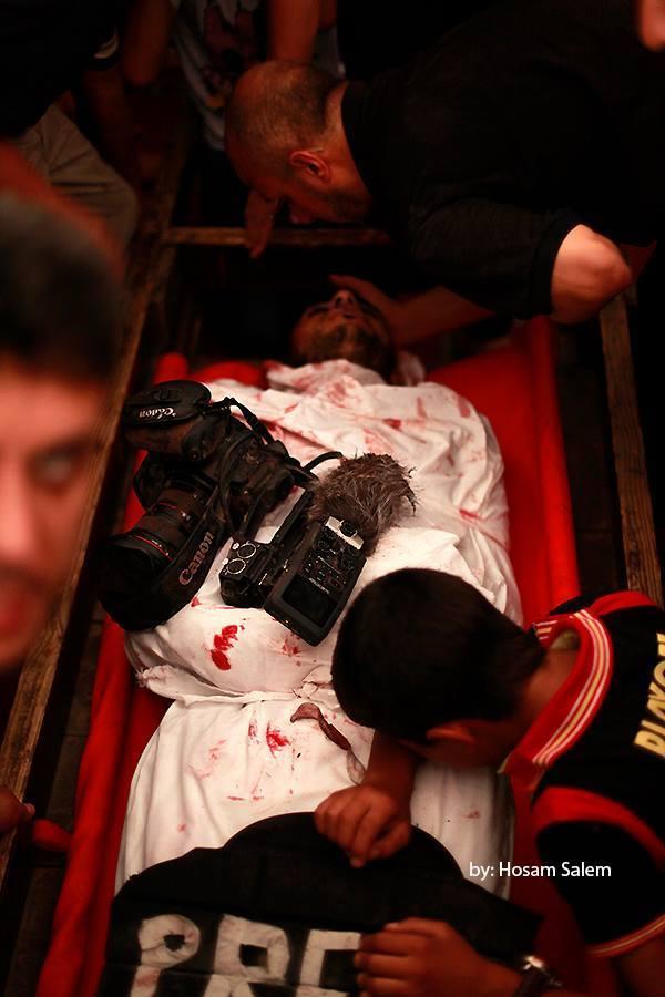 Funeral martyr journalist "Khaled Hamad" attacked by Israeli Forces at #Shijaia via @saidshouib  