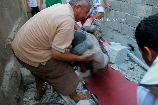 أحد الشهداء الذين تم انتشال جثامينهم من تحت الأنقاض  One of martyrs during the extraction from under the ruins Photo by Omar el Qattaa