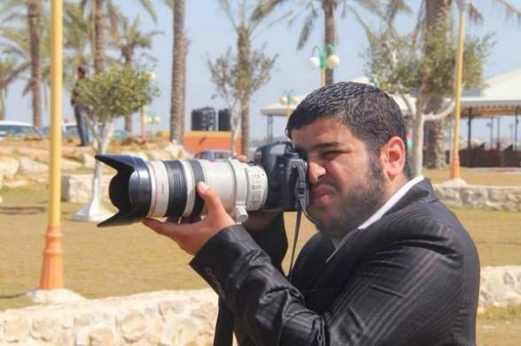 Photo journalist Ezzat Duhair, killed with 4 members of his family