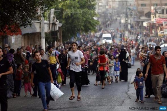 Civilians flee in en masses to escape imminent Death by terrorist Israel via @YousefAljamal 